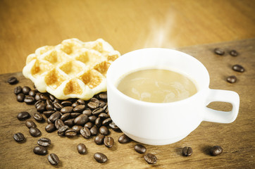 Coffee cup with grains and waffle