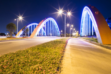 Obraz premium arch bridge with neon lamp