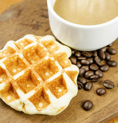 Coffee cup with grains and waffle