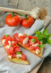 Fresh homemade crispy Italian antipasto called Bruschetta