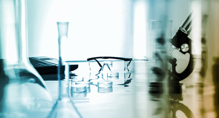miicroscope and plastic safety glasses in  lab