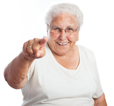 Elder Woman Pointing On A White Background