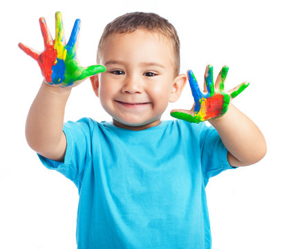 Child with painted hands on a white background