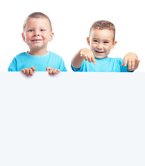 children behind a billboard with a blue t-shirt on a white backg