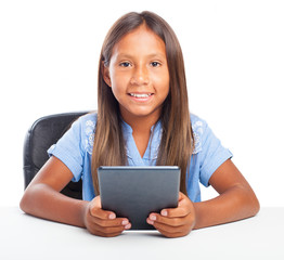 Fototapeta premium girl playing with a tablet on a white background