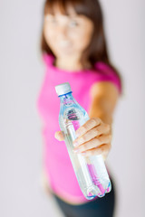 sporty woman with bottle of water