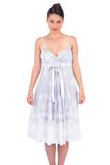 Seductive young model in summer dress posing
