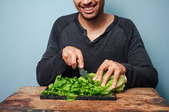 Man chopping lettuce
