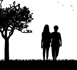Fototapeta na wymiar Mother and daughter walking in park silhouette