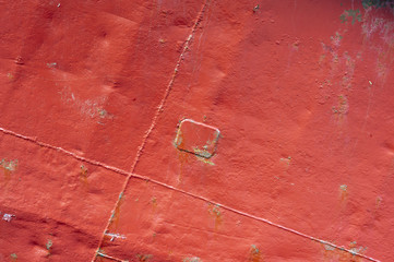 Red rusty metal texture with a big spot