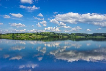 Obraz na płótnie Canvas Reflection of a blue Vlasina lake. Horizontal landscape.