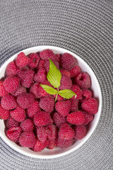raspberries in a white bowl