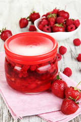 Home made berry jam on wooden table