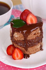 Chocolate cake with strawberry on table close-up