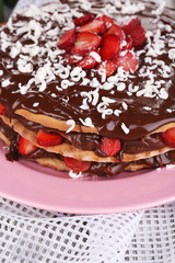 Chocolate cake on wooden table close-up