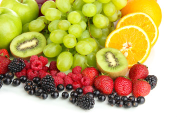 Fresh fruits and berries isolated on white