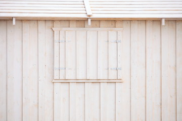 white wooden building wall on beach