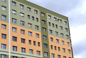 Big condominium apartment block. Skyscraper building house.