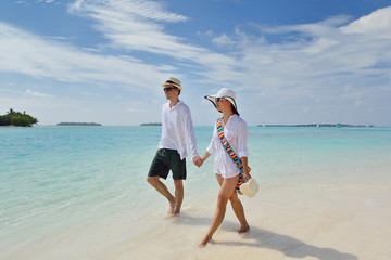 happy young couple have fun on beach