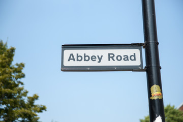 Abbet Road street sign against blue sky.