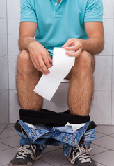 Close-up of a man in toilet - obrazy, fototapety, plakaty