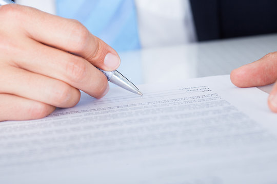 Businessman Signing Contract Paper