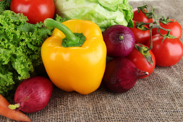 Fresh vegetables on burlap background