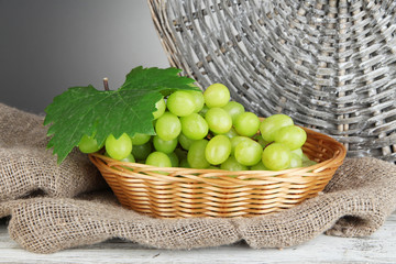 Ripe delicious grapes in wicker basket