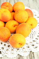 Fresh natural apricot on wooden table close up