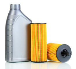 Car oil filters and motor oil can isolated on white