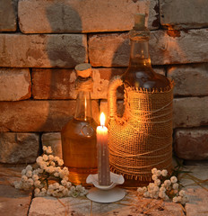 Two bottles on stone wall background