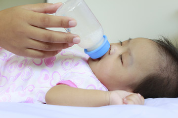 Baby drink milk and sleep