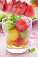 The dessert salad of watermelon and cantaloupe with honey.