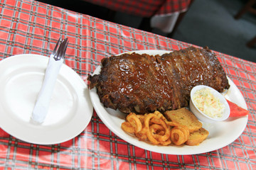 Rib meat set served with curly fried, bread, salad, watermelon