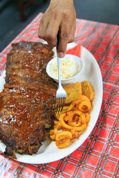 Rib meat set served with curly fried, bread, salad, watermelon