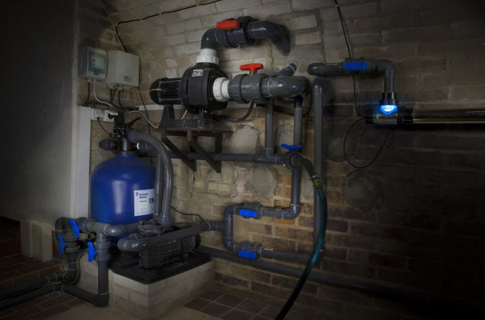 Swimming pool filtration system at basement
