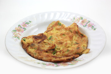 scrambled eggs with fresh herbs on a white background