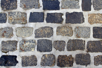 Spotted cobblestone and cement background