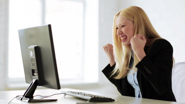 business woman with triumph expression in office