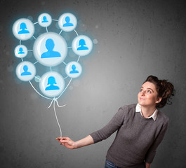 Woman holding social network balloon