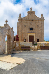 Fototapeta na wymiar Kuncizzjoni chapel and Fondazione Paola arch in Malta