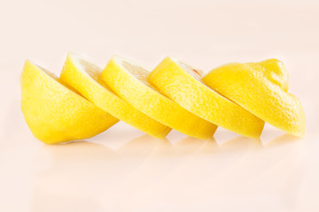 Row of juicy yellow lemon sliced wheels