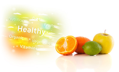 Naklejka premium Colorful juicy fruits with healthy text and signs
