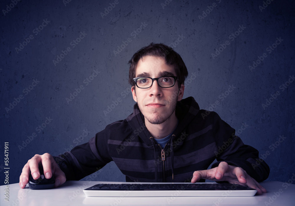 Fototapete hacker working with keyboard on blue background
