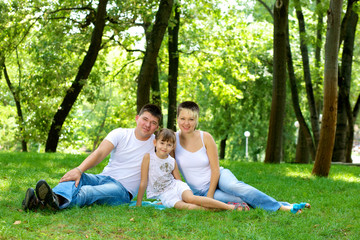 Family resting in nature.