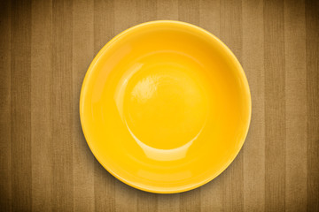 Colorful empty plate on grungy background table