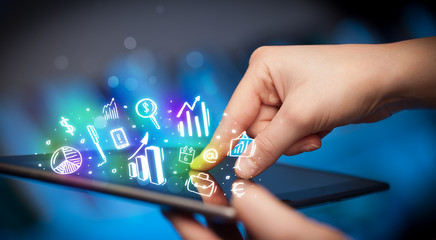 Hand touching tablet pc, charts concept