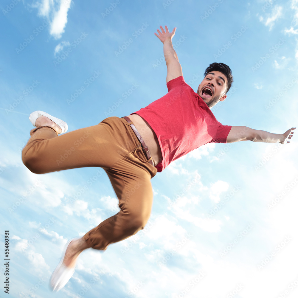 Poster casual man jumping outdoor