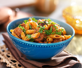 bowl of rigatoni pasta with sausage