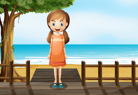 A smiling young girl standing at the wooden bridge